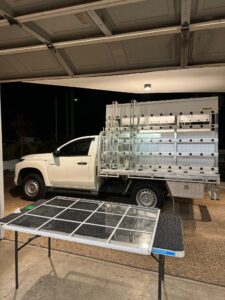 a white truck with a metal rack