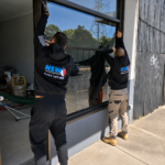 NSW Glass Masters technicians installing commercial shopfront glass in Sydney