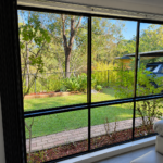 Broken Window Glass Repairs 3 Completed residential window glass replacement with clean black framed window at a Sydney home