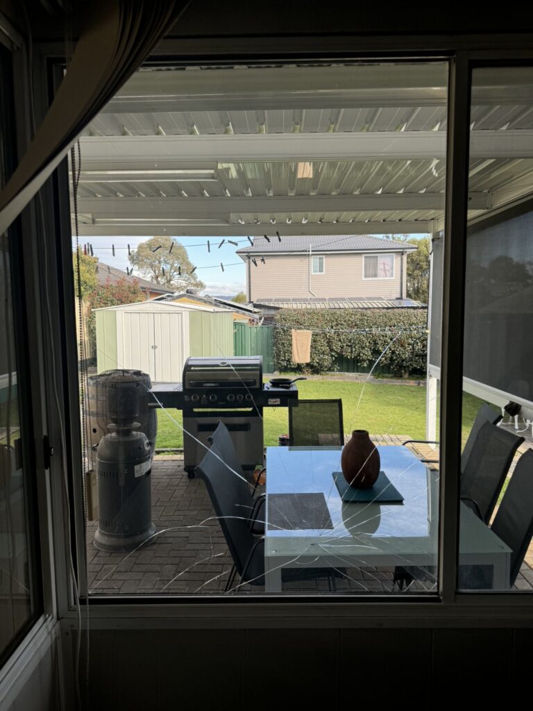 Large residential window glass before replacement at a Sydney property