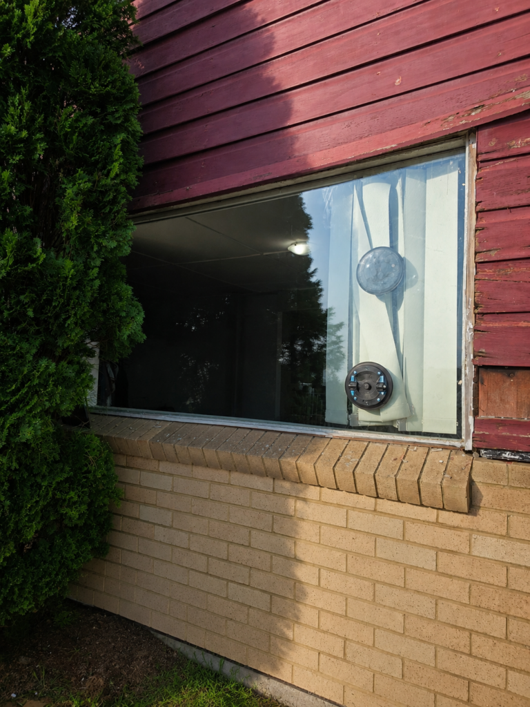 Residential window glass before replacement with suction lifter attached in Sydney