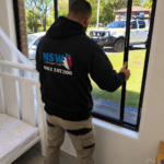 Broken Window Glass Repairs 6 NSW Glass Masters technician replacing window glass at a Sydney home